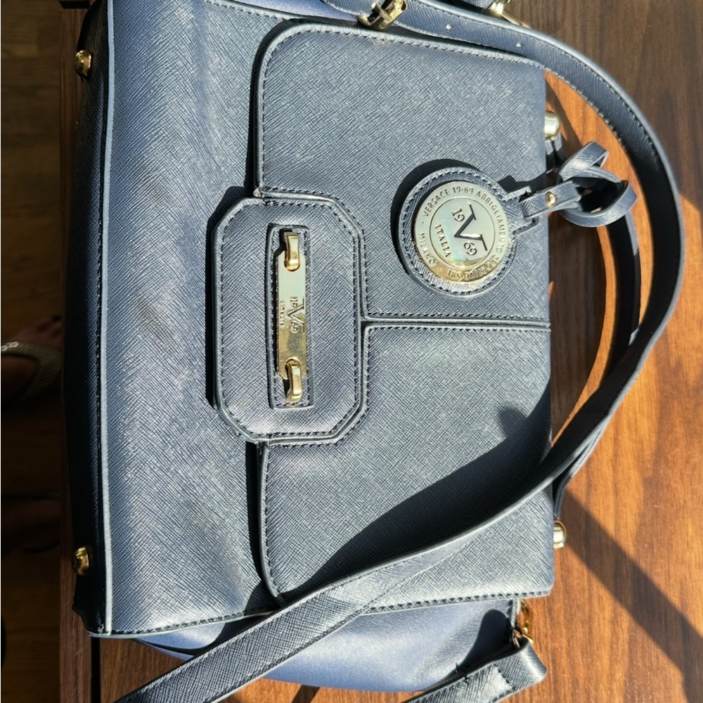 1969 V Italia bag, blue with shoulder strap. Elegant and solid.